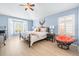 Comfortable bedroom with lots of light, ceiling fan and views through plantation shutters at 16802 Fairbolt Way, Odessa, FL 33556