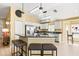 Bright, open kitchen featuring granite countertops, stainless steel appliances and a breakfast bar at 16802 Fairbolt Way, Odessa, FL 33556