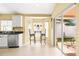 Bright kitchen boasts stainless steel appliances and a charming breakfast nook with slider doors to patio at 16802 Fairbolt Way, Odessa, FL 33556