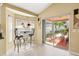 Breakfast nook with bar seating and sliding glass doors accessing the covered and screened patio at 16802 Fairbolt Way, Odessa, FL 33556