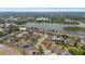 Aerial view of neighborhood homes with private pools, lake access and boat ramp and dock at 1755 Open Field Loop, Brandon, FL 33510