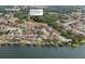 Aerial view showcasing the community, nearby park, and waterfront access with boat ramp and dock at 1755 Open Field Loop, Brandon, FL 33510