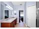 Bathroom featuring double vanity, tile floors, and large closet access at 1755 Open Field Loop, Brandon, FL 33510