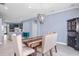 Cozy dining area adjacent to the kitchen, features a dark wood cabinet and decorative chandelier at 1755 Open Field Loop, Brandon, FL 33510
