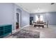 Bright dining area with tile floors, elegant chandelier, and access to the backyard at 1755 Open Field Loop, Brandon, FL 33510