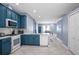Spacious kitchen with blue cabinets, white countertops, and stainless steel appliances at 1755 Open Field Loop, Brandon, FL 33510