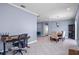 Open concept living area showing dining area and adjacent workstation with natural lighting at 1755 Open Field Loop, Brandon, FL 33510