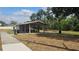 Covered picnic pavilion with tables and benches in a park setting, perfect for outdoor gatherings at 1755 Open Field Loop, Brandon, FL 33510