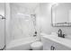 Modern bathroom featuring marble style tile, matte black hardware, and tub with shower head at 1924 Sean Wood Cir, Brandon, FL 33510