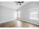Bedroom with two windows, laminate floors and ceiling fan at 1924 Sean Wood Cir, Brandon, FL 33510