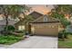 Charming single Gathering home featuring a well manicured lawn and a two-car garage at 1924 Sean Wood Cir, Brandon, FL 33510