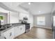 Modern kitchen with sleek white cabinets, stainless steel appliances, and a granite countertop at 1924 Sean Wood Cir, Brandon, FL 33510