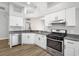 Beautiful kitchen with white cabinets, granite countertops and stainless steel appliances at 1924 Sean Wood Cir, Brandon, FL 33510