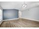 Empty living room area with hardwood floors, bright natural light and neutral colors at 1924 Sean Wood Cir, Brandon, FL 33510