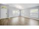 Spacious living room featuring gleaming hardwood floors and bright natural light at 1924 Sean Wood Cir, Brandon, FL 33510