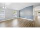 Unfurnished living room with hardwood floors and open-concept layout with ample natural light at 1924 Sean Wood Cir, Brandon, FL 33510