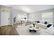 Bright living room with vaulted ceilings, a dining area, and modern decor at 1924 Sean Wood Cir, Brandon, FL 33510