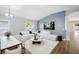 Open-concept living room area with accent wall, hardwood floors and dining area at 1924 Sean Wood Cir, Brandon, FL 33510
