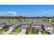 Aerial view of a well-maintained community with a scenic lake and fountain at 21003 Monza Loop, Land O Lakes, FL 34638