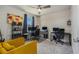 Cozy bedroom features a ceiling fan and two workstations with multiple monitors at 21003 Monza Loop, Land O Lakes, FL 34638