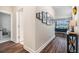 Inviting hallway with hardwood floors, leading into a spacious living area and scenic view at 21003 Monza Loop, Land O Lakes, FL 34638
