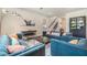 Cozy living room featuring stylish furniture, a staircase, and modern decor at 21003 Monza Loop, Land O Lakes, FL 34638
