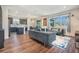 Open-concept living area with a modern kitchen, stylish furnishings, and lots of natural light at 21003 Monza Loop, Land O Lakes, FL 34638