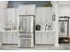 Updated kitchen showcases stainless steel refrigerator and ample cabinet space, creating a functional design at 21746 Amelia Rose Way, Land O Lakes, FL 34637