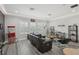Cozy living room features movie-themed decor, comfortable seating, and plenty of room to relax at 21746 Amelia Rose Way, Land O Lakes, FL 34637