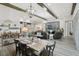 Open-concept living space with dining table and chairs and a comfortable seating area and modern decor at 21746 Amelia Rose Way, Land O Lakes, FL 34637