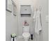 Small toilet room featuring modern fixtures, neutral walls, and ample storage at 21746 Amelia Rose Way, Land O Lakes, FL 34637
