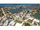 Waterfront property with canal access features beautifully landscaped grounds and a private dock at 2202 Donato Dr, Belleair Beach, FL 33786