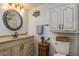 Cozy bathroom featuring a vanity, storage cabinet, and decorative accents at 2202 Donato Dr, Belleair Beach, FL 33786