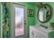 Hall bathroom features a single vanity, framed mirror, and bright walls at 2202 Donato Dr, Belleair Beach, FL 33786