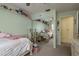 Bright bedroom features twin beds, plush carpeting, and charming decor, creating a comfortable and inviting space at 2202 Donato Dr, Belleair Beach, FL 33786