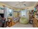 bedroom features a twin bed, a gaming setup, and playful decorations and a large beanbag at 2202 Donato Dr, Belleair Beach, FL 33786