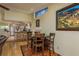 Dining area with wooden table and chairs, adjacent to a kitchen with stainless steel appliances at 2202 Donato Dr, Belleair Beach, FL 33786