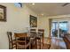Dining room with seating for four, a wine rack, and natural lighting at 2202 Donato Dr, Belleair Beach, FL 33786
