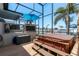 Outdoor hot tub with covered patio, offering stunning water views, for ultimate relaxation at 2202 Donato Dr, Belleair Beach, FL 33786