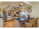 Traditional kitchen featuring granite countertops, stainless steel appliances, and a central island at 2202 Donato Dr, Belleair Beach, FL 33786