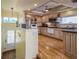A spacious kitchen with wooden floors, modern appliances, and lots of storage cabinets at 2202 Donato Dr, Belleair Beach, FL 33786