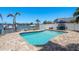 Inviting pool with brick-paver decking and waterfront views, perfect for outdoor relaxation and entertainment at 2202 Donato Dr, Belleair Beach, FL 33786