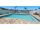 Beautiful pool featuring an adjacent boat dock, promising endless waterfront fun and relaxation at 2202 Donato Dr, Belleair Beach, FL 33786