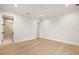 Modern bedroom with hardwood flooring, neutral walls, and an ensuite bathroom with glass shower at 2218 S Occident St, Tampa, FL 33629