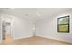 Bright bedroom with white walls, hardwood floors, and a large window offering natural light at 2218 S Occident St, Tampa, FL 33629