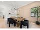 Bright dining room featuring a large wooden table, striking light fixture, and modern chairs at 2218 S Occident St, Tampa, FL 33629