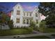Stunning two-story modern farmhouse exterior with landscaped yard and welcoming front porch at 2218 S Occident St, Tampa, FL 33629