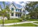 Charming two-story home with modern farmhouse design, lush lawn and mature landscaping at 2218 S Occident St, Tampa, FL 33629