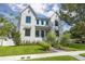 Striking two-story home with modern farmhouse design, lush lawn and mature landscaping at 2218 S Occident St, Tampa, FL 33629