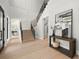 Grand foyer with high ceilings, hardwood floors, staircase with black iron railing, and stylish decor at 2218 S Occident St, Tampa, FL 33629